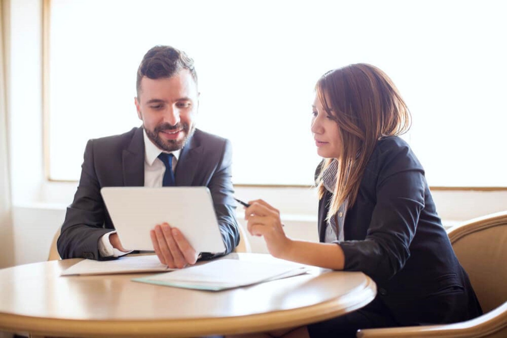 Finance managers talking over documents