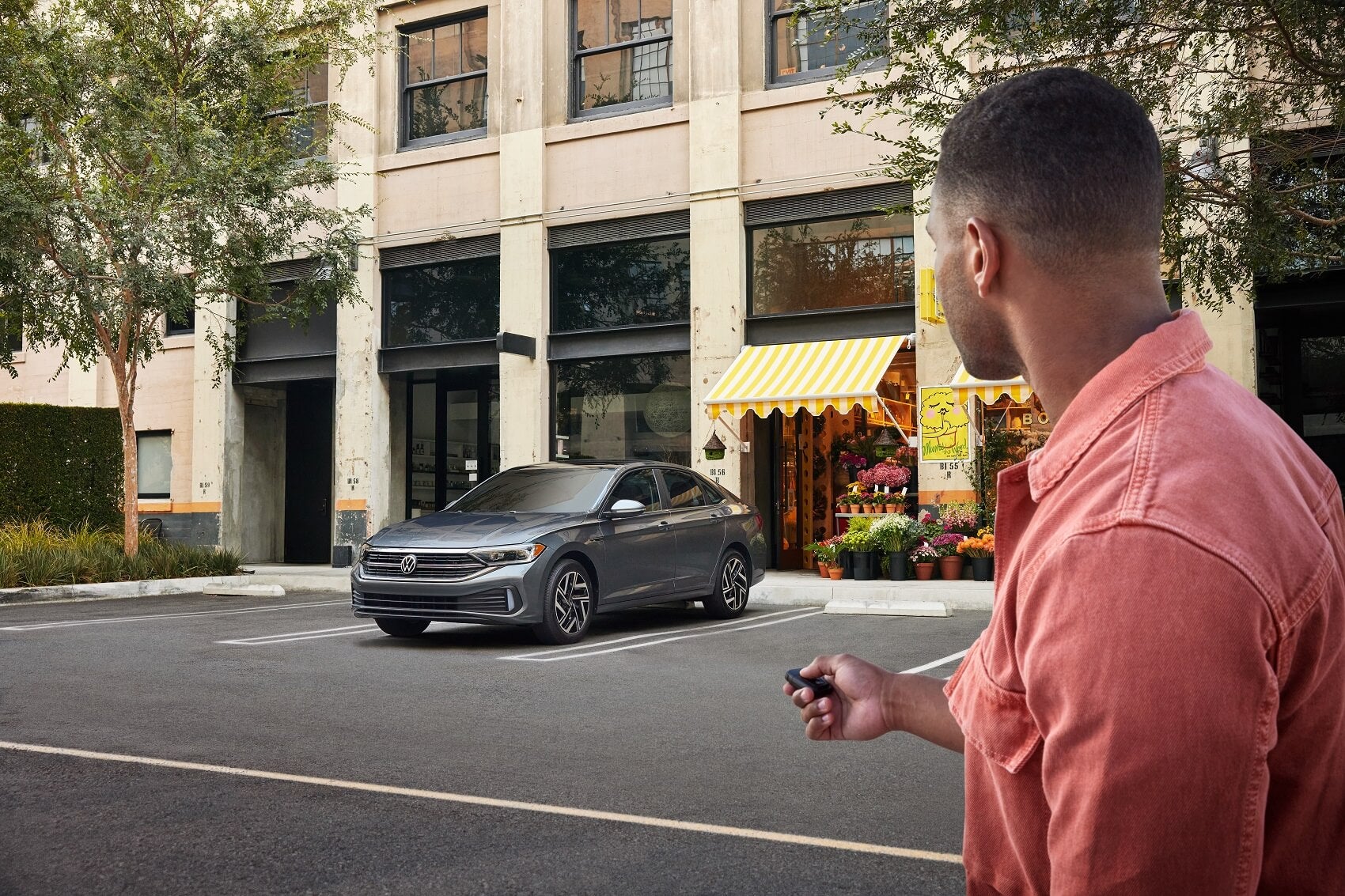 Owner locking Volkswagen Jetta with key fob